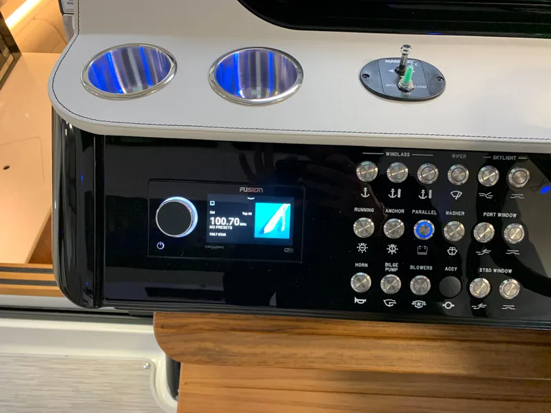 Slide: The Image of Control panel of 2023 Sea Ray Sundancer 370 OB boat with Fusion audio system. - 24