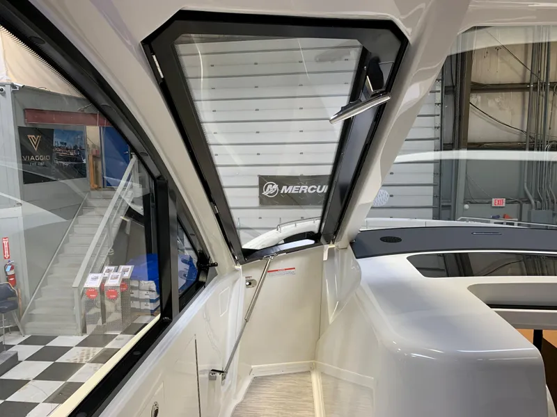 Slide: The Image of 2023 Sea Ray Sundancer 370 OB interior view with open window. - 26
