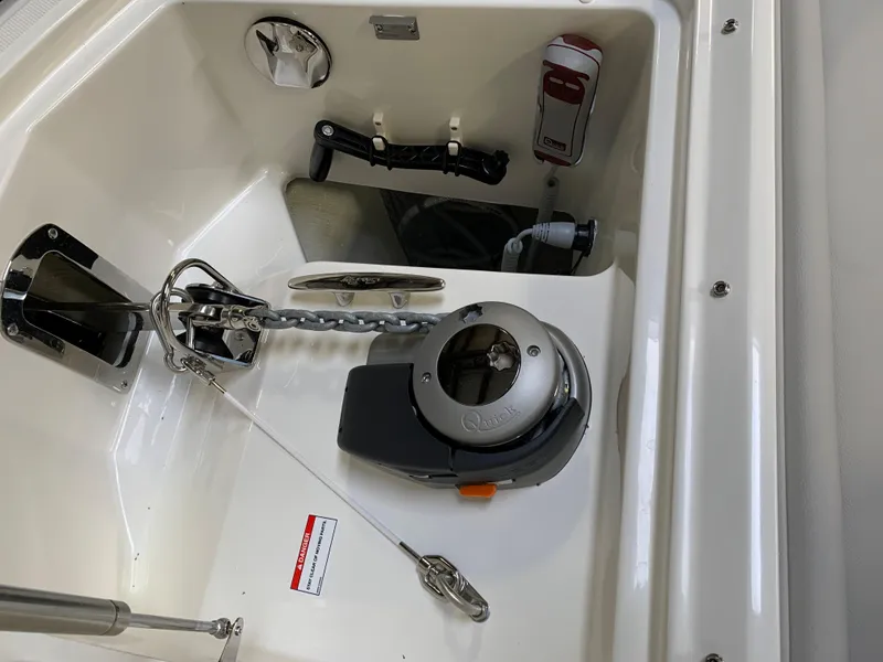 Slide: The Image of 2023 Sea Ray Sundancer 370 OB anchor compartment with windlass and chain. - 30