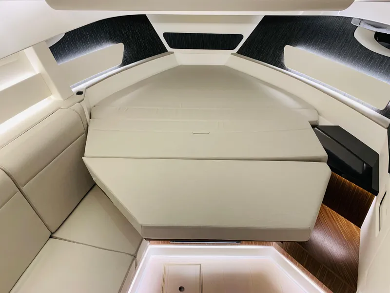 Slide: The Image of 2023 Sea Ray Sundancer 370 OB cabin interior with modern seating and lighting. - 33