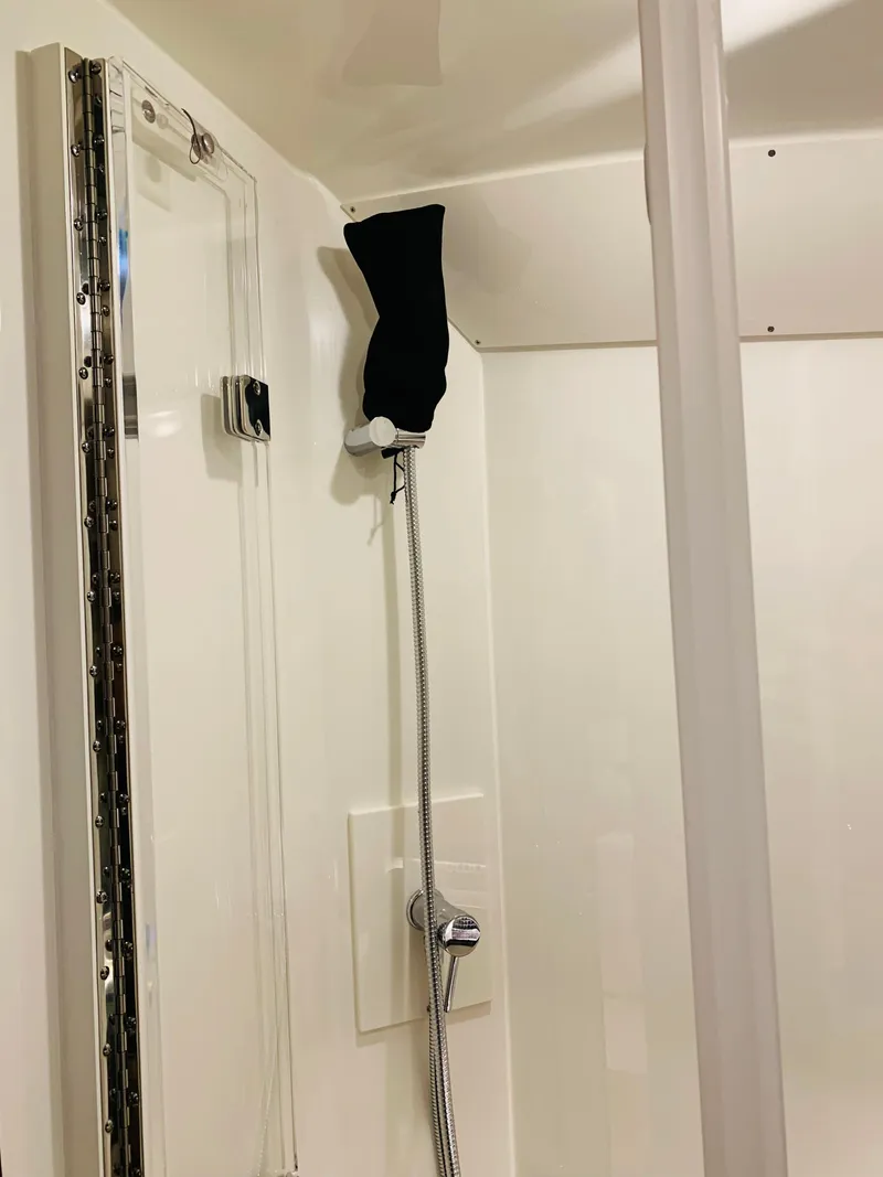 Slide: The Image of 2023 Sea Ray Sundancer 370 OB shower area with modern fixtures. - 37