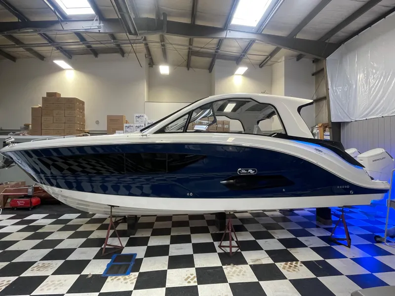 Slide: The Image of 2023 Sea Ray Sundancer 370 OB in showroom on checkered floor. - 4