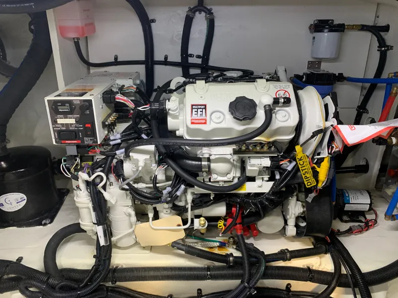 Slide: The Image of 2023 Sea Ray Sundancer 370 OB engine compartment with EFI system and wiring. - 46