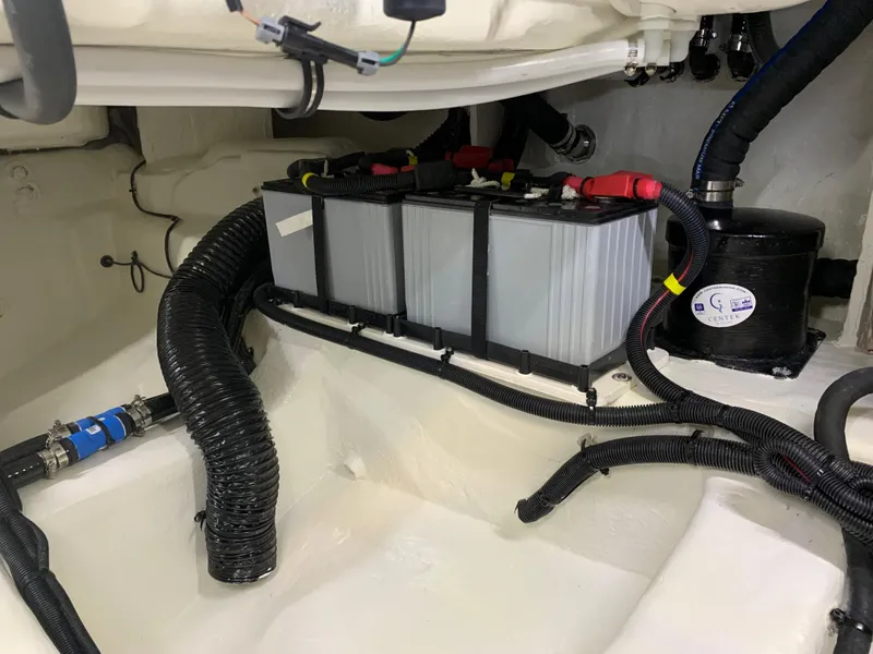 Slide: The Image of 2023 Sea Ray Sundancer 370 OB engine compartment with batteries and wiring. - 47