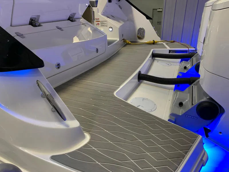 Slide: The Image of 2023 Sea Ray Sundancer 370 OB boat deck with modern design and blue LED lighting. - 7