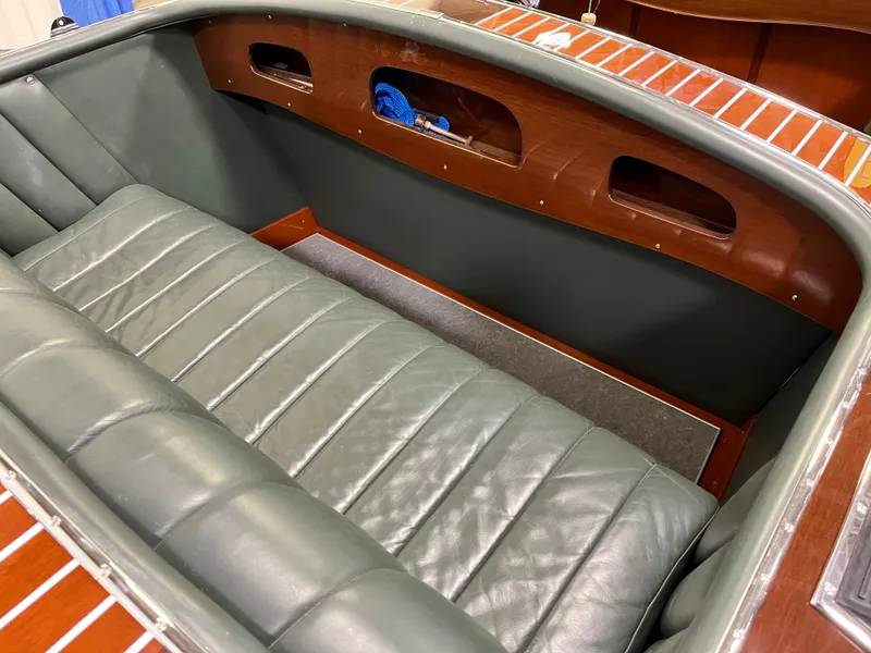 Slide: The Image of 1932 Hacker-Craft Triple Cockpit with leather seating and wooden interior details. - 12