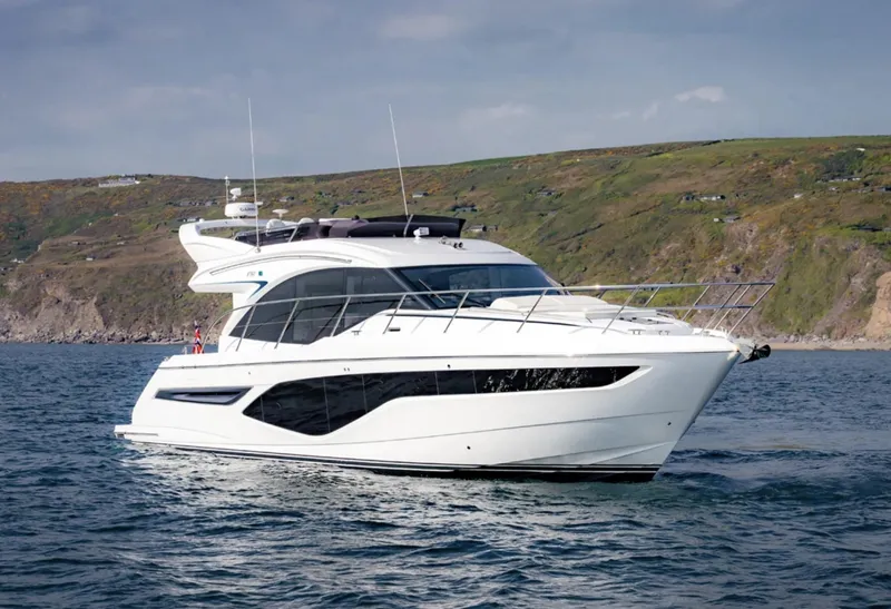 Slide: The Image of 2025 Princess F50 yacht cruising near a scenic coastline. - 0