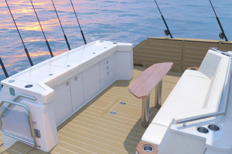 Slide: The Image of 2024 Tiara Yachts EX 60 deck with seating and fishing rod holders. - 14