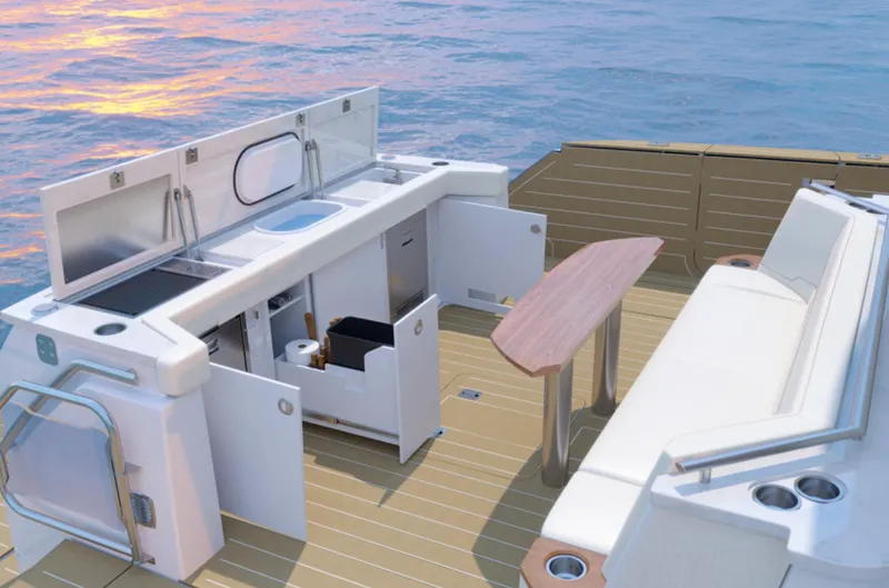 Slide: The Image of 2024 Tiara Yachts EX 60 deck with outdoor kitchen and seating area. - 15