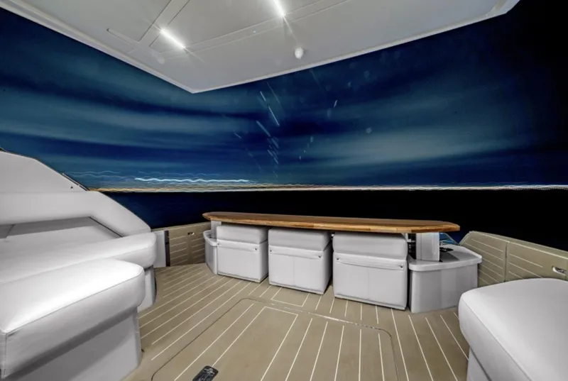 Slide: The Image of Luxurious 2024 Tiara Yachts EX 60 interior with sleek seating and modern design. - 24