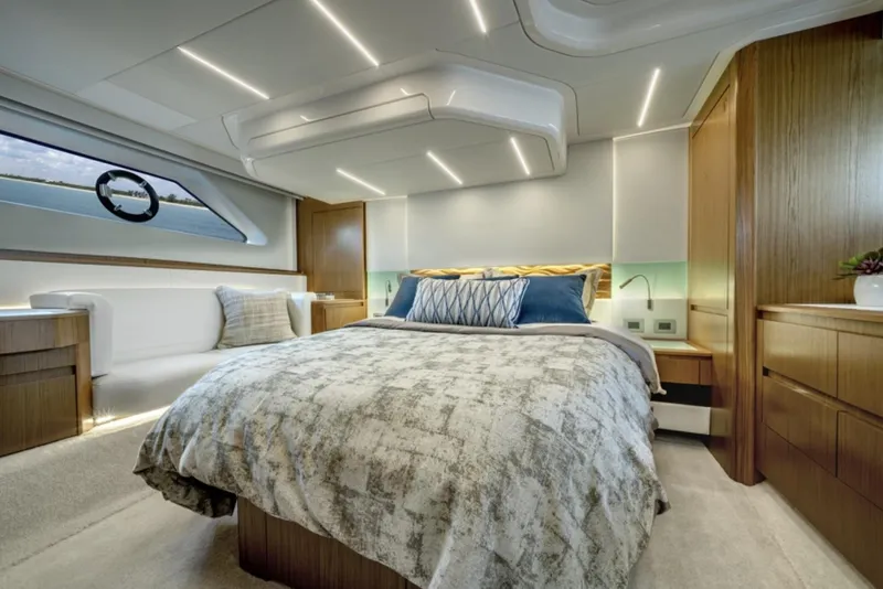 Slide: The Image of Luxurious bedroom interior of 2024 Tiara Yachts EX 60 with modern lighting and elegant decor. - 38