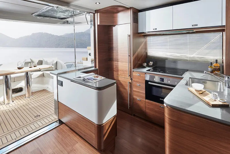 Slide: The Image of Luxurious kitchen and dining area on the 2025 Princess F55 yacht. - 19