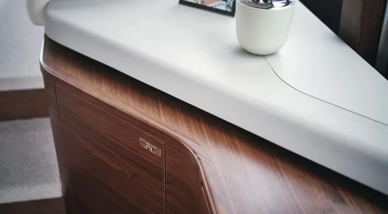 Slide: The Image of Interior detail of the 2025 Princess F55 yacht, featuring sleek wood and modern design. - 23