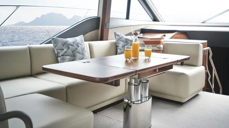 Slide: The Image of Luxurious interior of Princess F55 yacht, 2025 model, with elegant seating and ocean view. - 26