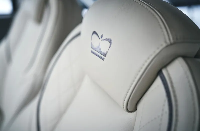 Slide: The Image of Luxurious leather seats in the 2025 Princess F55 with embroidered crown logo. - 33