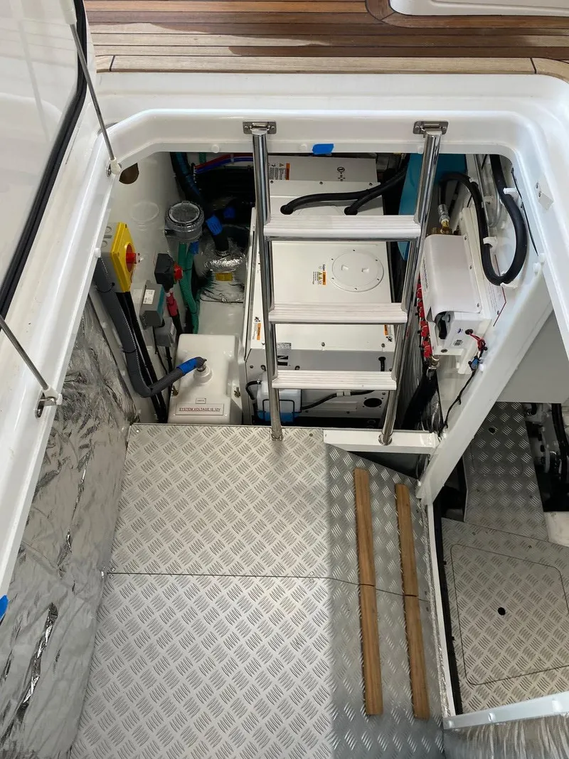 Slide: The Image of Engine room of a 2025 Princess F55 yacht with ladder and equipment. - 45
