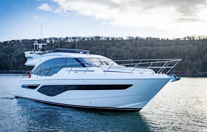 Slide: The Image of 2025 Princess F55 yacht cruising on a serene lake. - 6