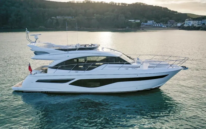 Slide: The Image of 2025 Princess F55 yacht cruising on a serene lake. - 7