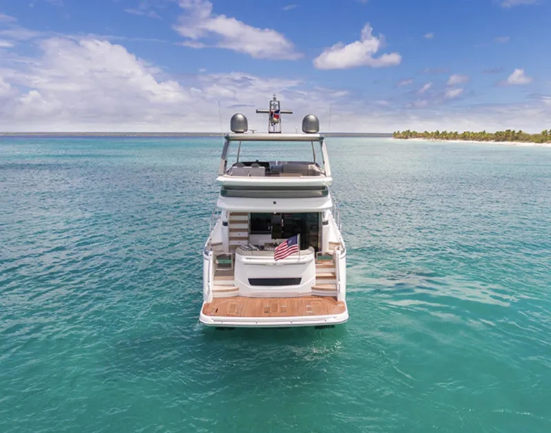 Slide: The Image of 2025 Princess F55 yacht on clear turquoise water near a tropical island. - 9