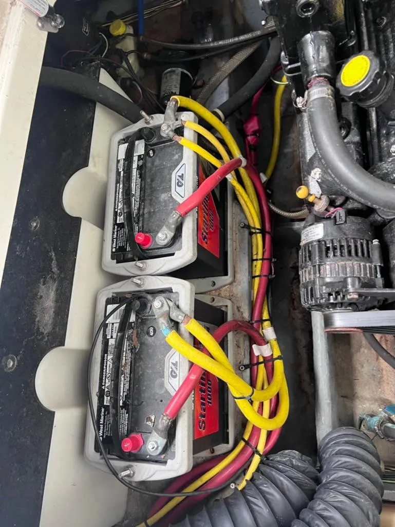 Slide: The Image of 2005 Maxum 2500 SCR boat engine compartment with dual batteries and wiring. - 22