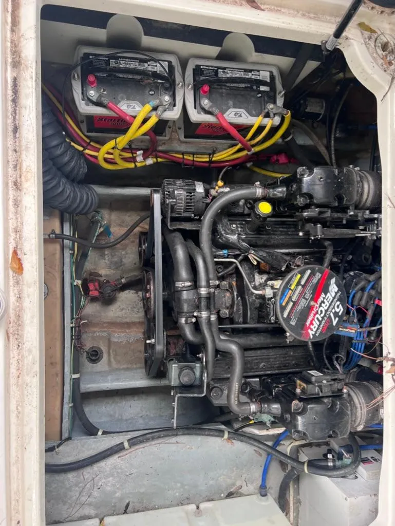 Slide: The Image of Engine compartment of a 2005 Maxum 2500 SCR boat with dual batteries and MerCruiser 5.7 engine. - 23