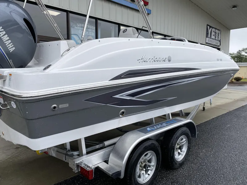 Slide: The Image of 2023 Hurricane SunDeck Sport 188 OB boat on a trailer. - 2