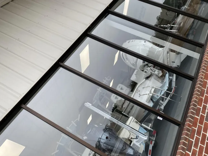 Slide: The Image of 2023 Hurricane SunDeck Sport 188 OB boat displayed in showroom. - 5