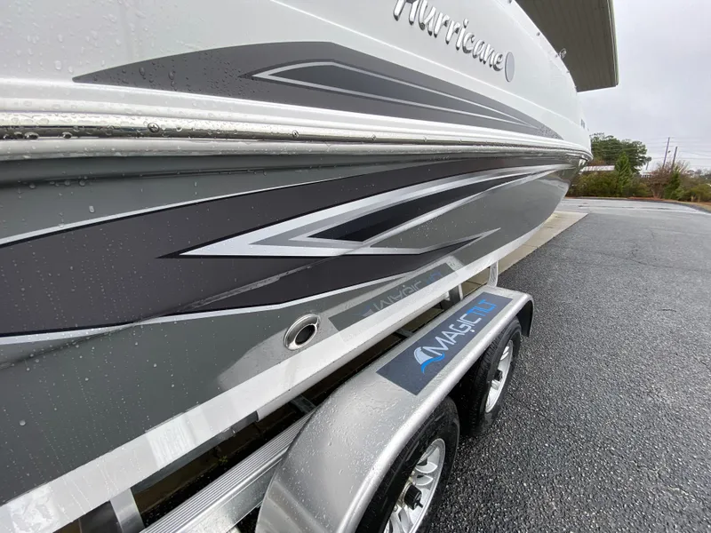 Slide: The Image of 2023 Hurricane SunDeck Sport 188 OB boat on trailer, side view. - 8