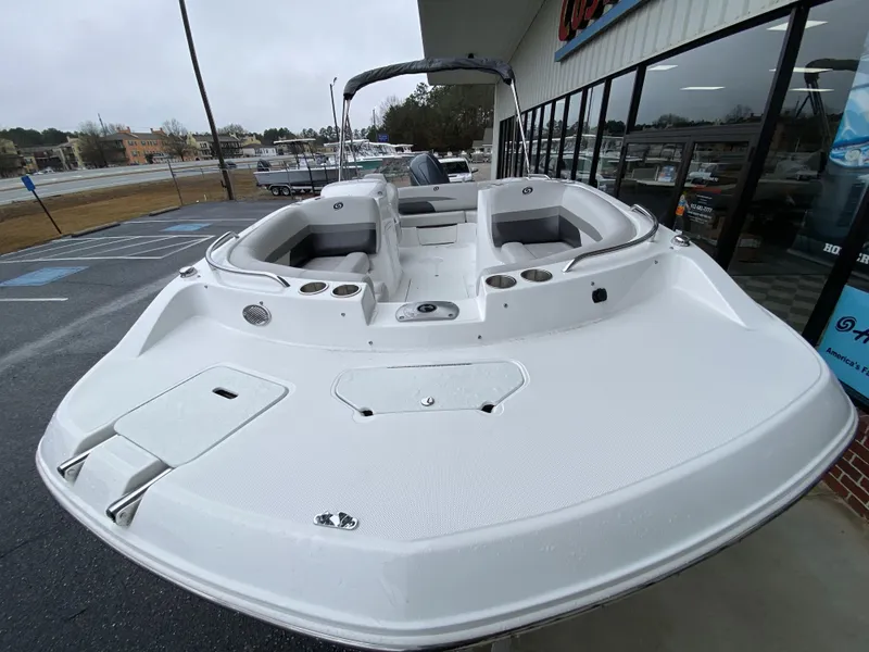 Slide: The Image of 2023 Hurricane SunDeck Sport 188 OB boat on display outside dealership. - 9