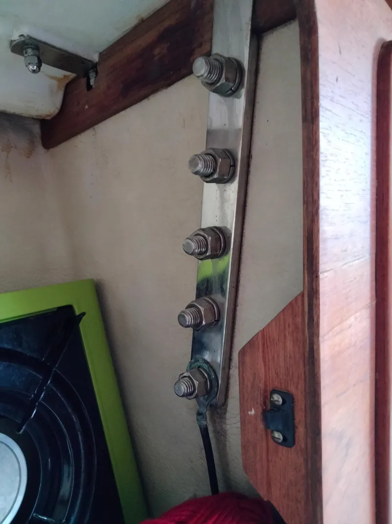 Slide: The Image of Interior detail of 1989 Sabre 34 MK II sailboat showing bolts and wooden trim. - 16