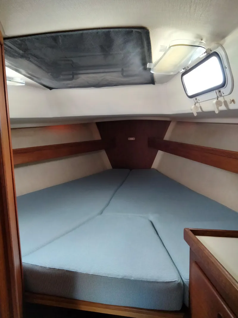Slide: The Image of 1989 Sabre 34 MK II sailboat interior cabin with V-berth and skylight. - 28