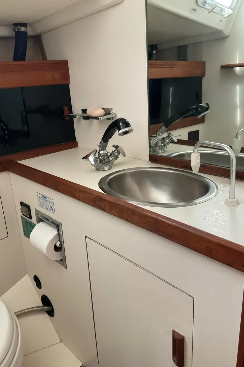 Slide: The Image of 1989 Sabre 34 MK II yacht bathroom with sink and mirror. - 29