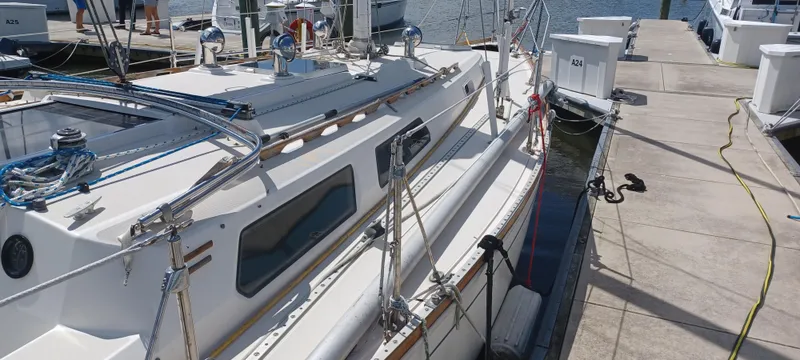 Slide: The Image of 1989 Sabre 34 MK II sailboat docked at marina, side view. - 3