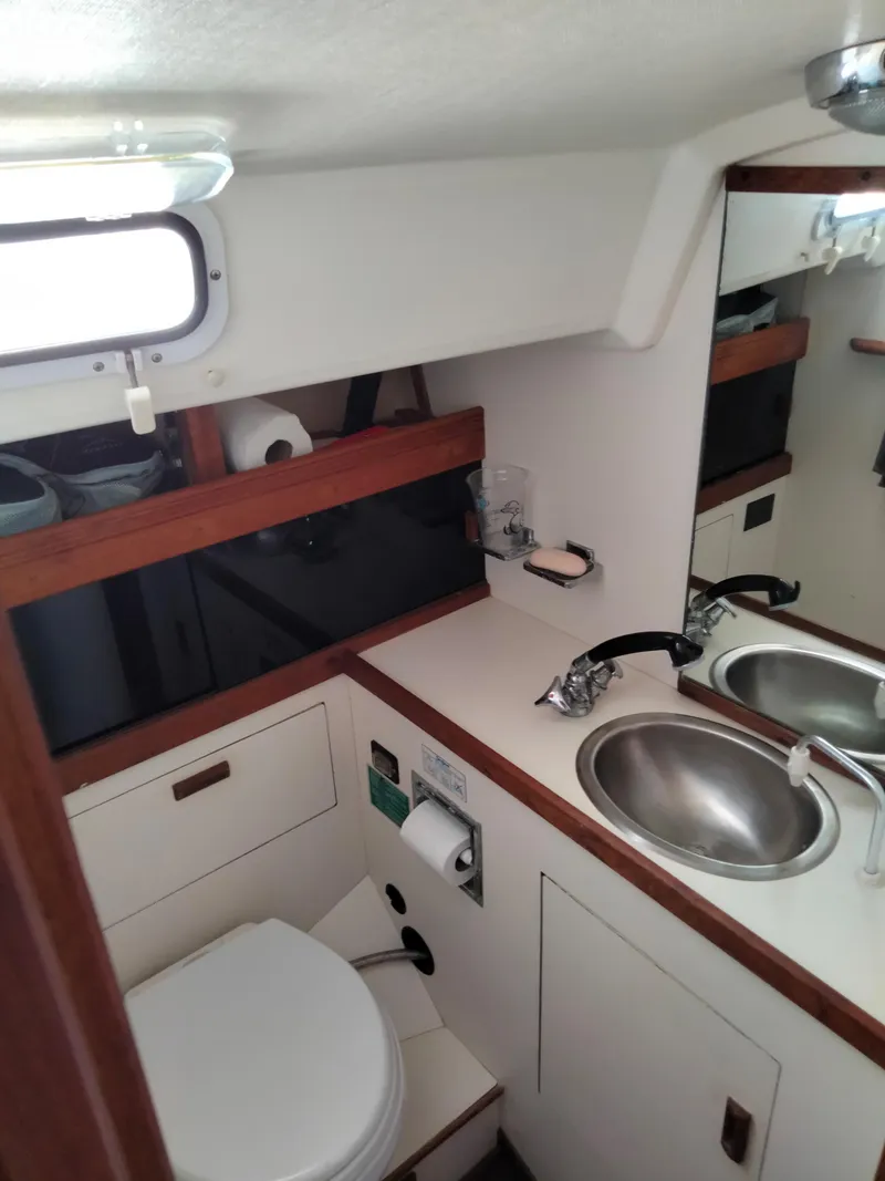 Slide: The Image of 1989 Sabre 34 MK II sailboat bathroom with sink and toilet. - 31