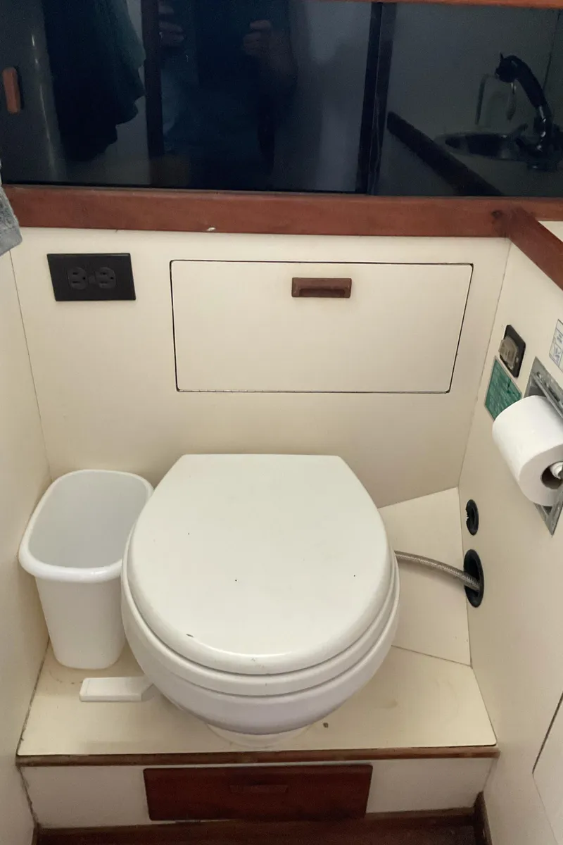 Slide: The Image of 1989 Sabre 34 MK II boat bathroom with toilet and trash bin - 32