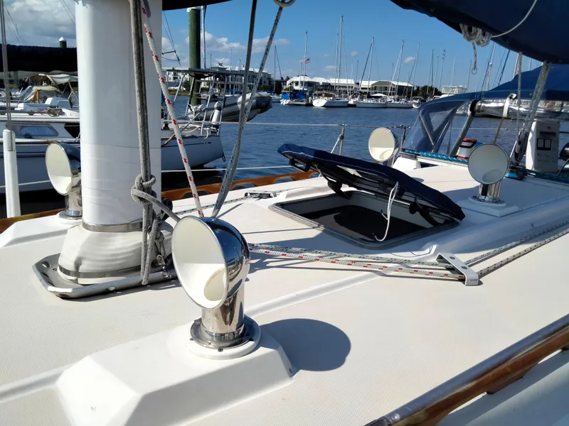 Slide: The Image of 1989 Sabre 34 MK II sailboat deck with marina background. - 5
