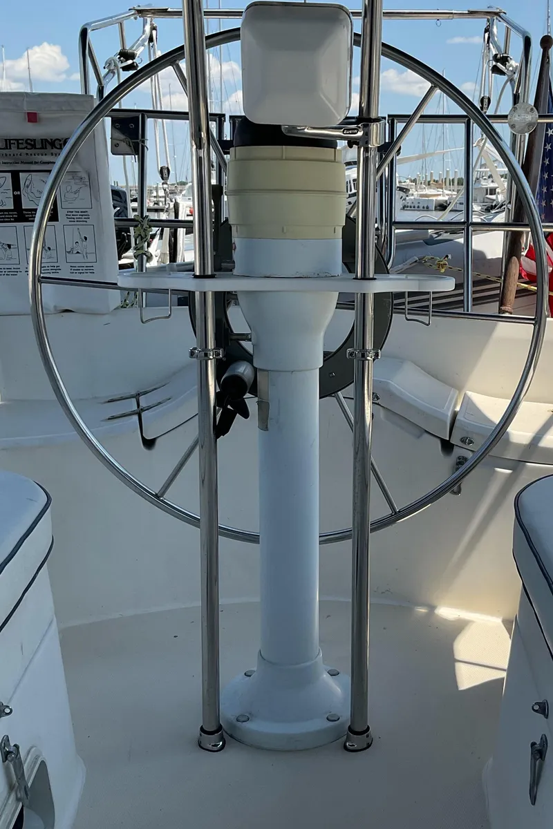 Slide: The Image of Cockpit of a 1989 Sabre 34 MK II sailboat with steering wheel and navigation equipment. - 9