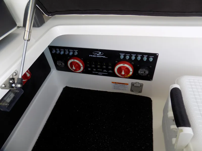 Slide: The Image of Control panel of 2021 Regal 29 OBX boat with switches and dials. - 12