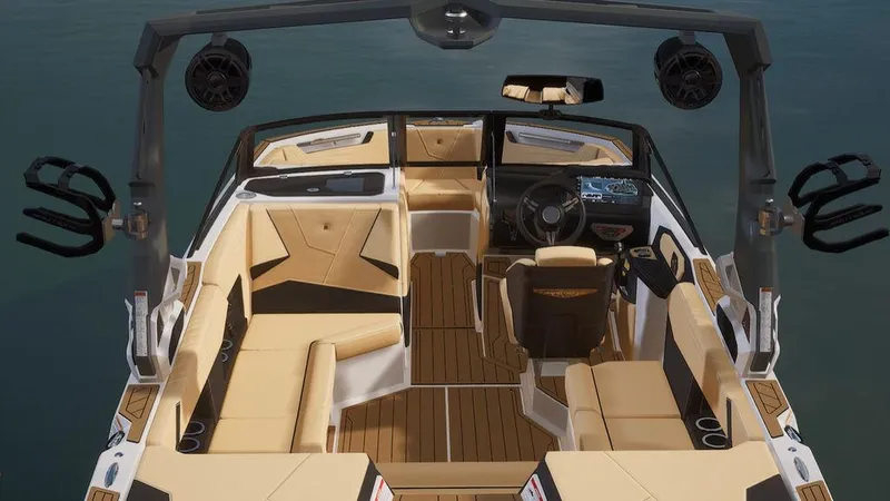 Slide: The Image of 2023 Nautique Super Air Nautique S21 interior with tan and black seating, advanced dashboard, and spacious layout. - 3