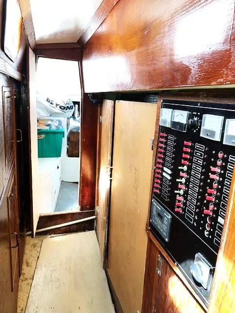 Slide: The Image of Toward aft stateroom showing doors to engine room and electrical panel - 24