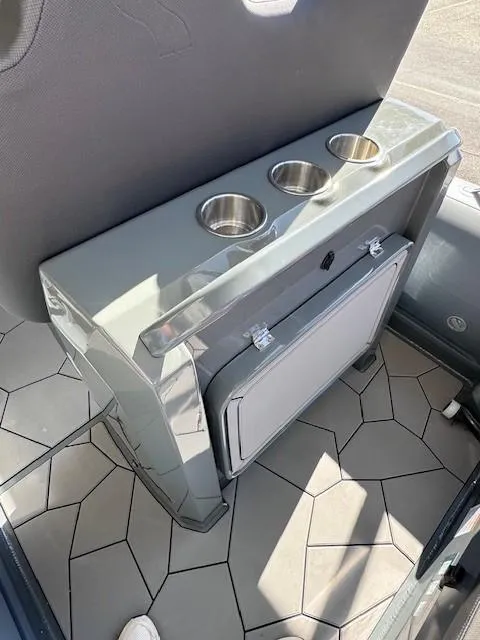 Slide: The Image of 2024 Highfield Sport 660 interior with cup holders and storage compartment. - 5