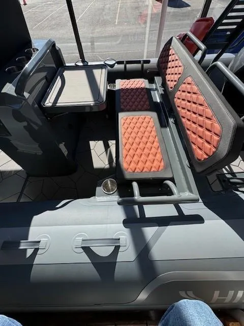 Slide: The Image of 2024 Highfield Sport 660 boat interior with quilted seating and modern design. - 6