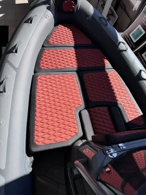 Slide: The Image of 2024 Highfield Sport 660 boat interior with red diamond-patterned seating. - 7