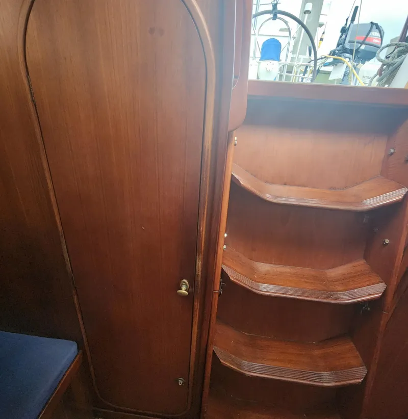 Slide: The Image of 1989 Granada 375 Atlantica yacht interior with wooden stairs and door. - 20