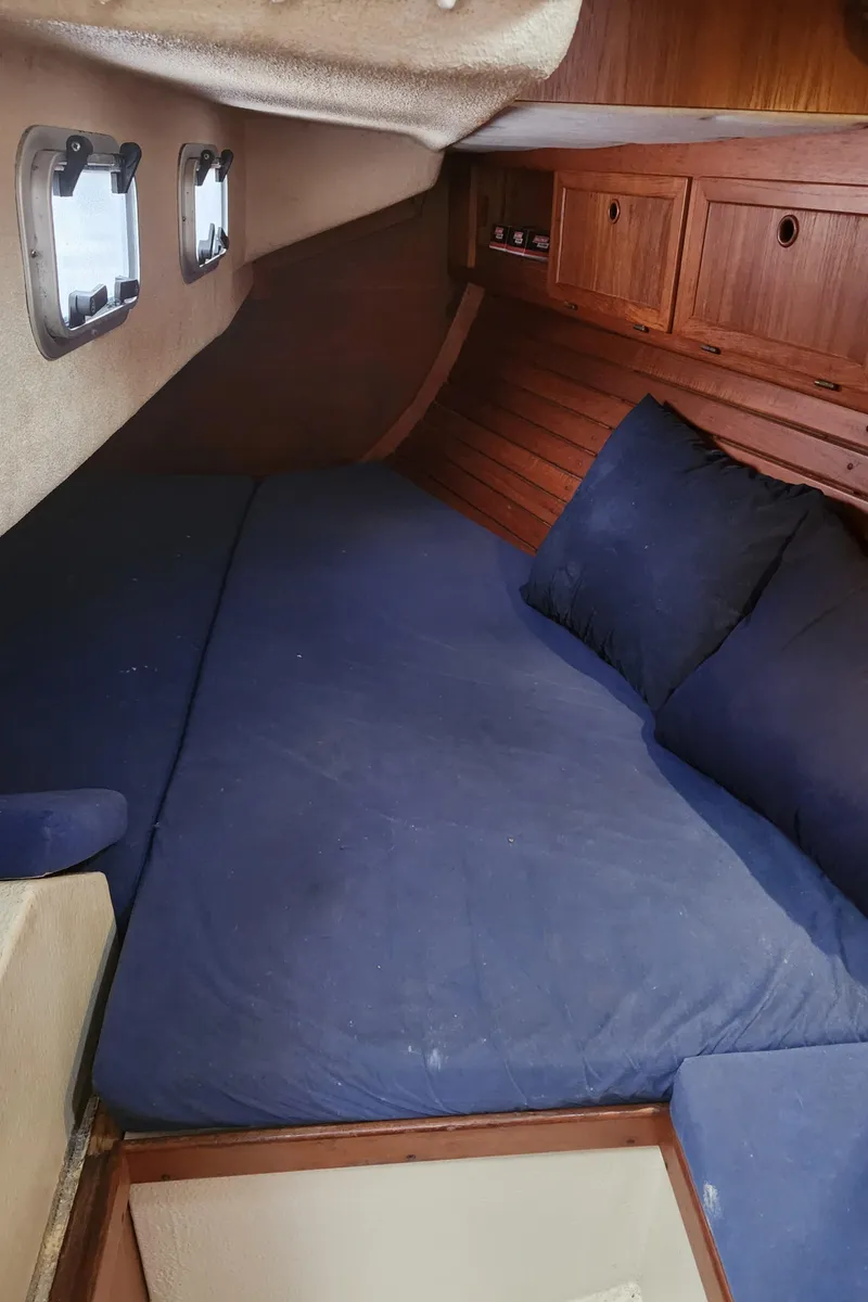 Slide: The Image of Cozy cabin interior of 1989 Granada 375 Atlantica sailboat with blue bedding. - 24