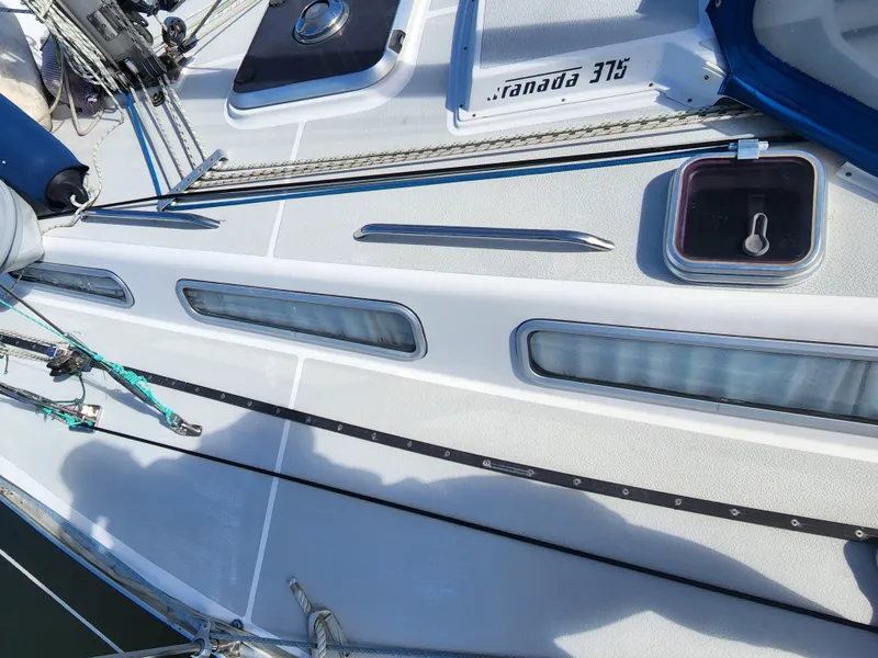 Slide: The Image of 1989 Granada 375 Atlantica sailboat deck with rigging and hatches. - 3