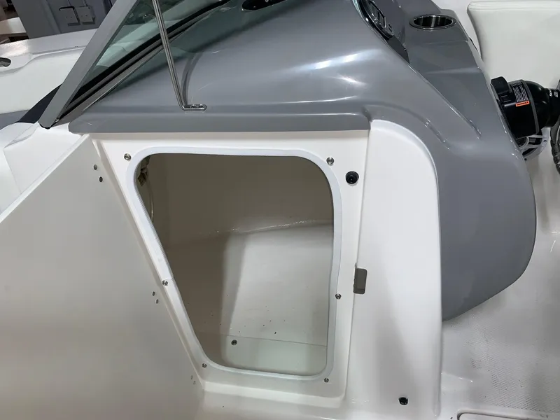Slide: The Image of 2024 Robalo R207 Dual Console storage compartment. - 7