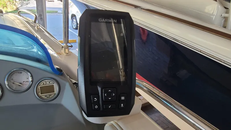 Slide: The Image of Garmin GPS on 2006 Bayliner 197 SD boat dashboard. - 16