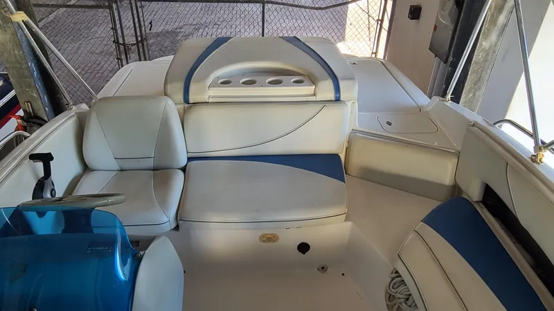 Slide: The Image of 2006 Bayliner 197 SD boat interior with white and blue seating. - 20