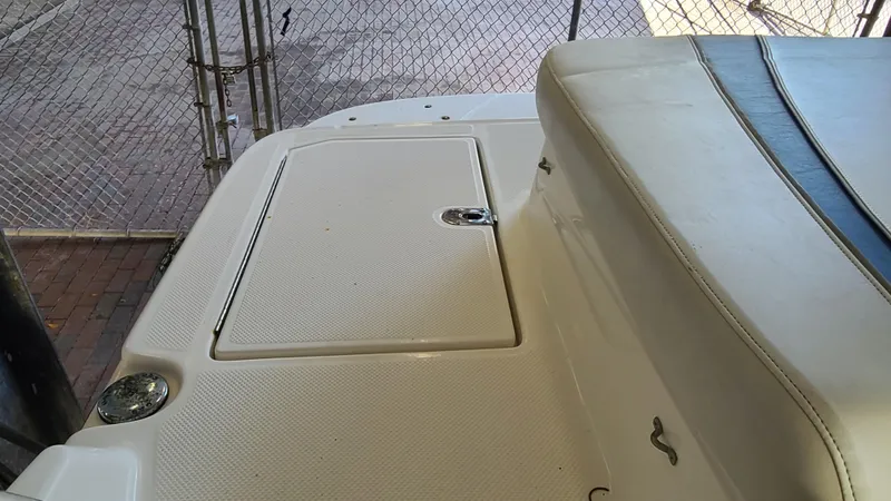 Slide: The Image of 2006 Bayliner 197 SD boat deck with storage compartment. - 24